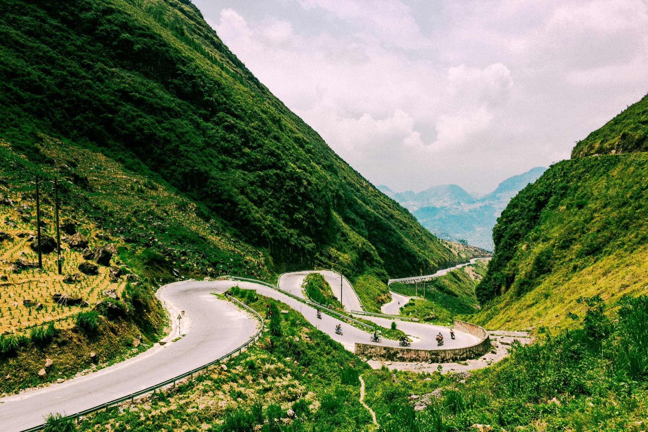 Motorbike riders on a mountain pass in Ha Giang, Northern Vietnam